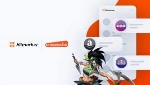 The League of Legends Champion, Akali, leaps across a white background, the hitmarker and crowdcube logos appear behind her. To the right is a flat icon version of the Hitmarker job app, showing logos from companies like the BBC, Rebdull and Amazon.