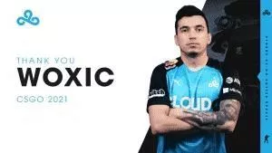 Özgür “woxic” Eker stands in a C9 jersey with the text 