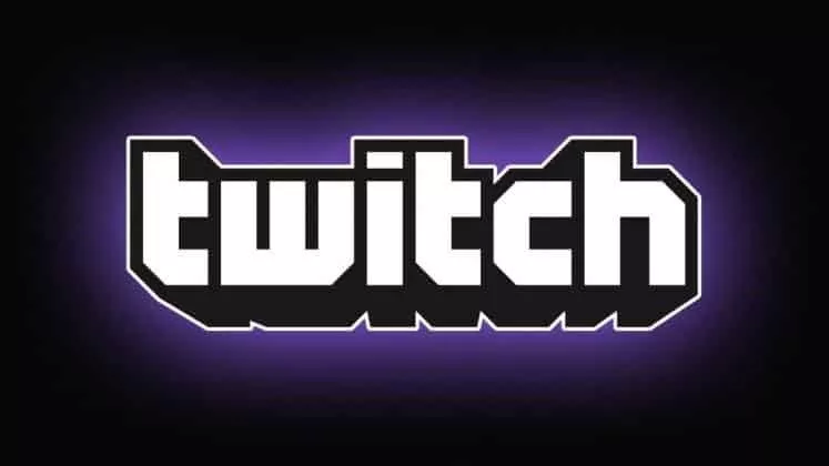 Слово «twitch» показано большими белыми буквами с фиолетовой аурой на черном фоне в виде логотипа Twitch TV.