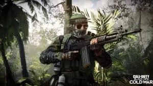 An operator in camo gear stalks through a tropical jungle with his FARA 83 raised and at the ready. The Call of Duty logo appears in the bottom right hand of the frame