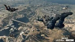 Operators parachute down toward a rocky landscape in a clip from Call of Duty Warzone