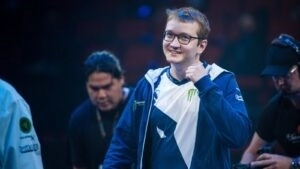 A young Matumbaman pumps his fist in the air on stage during his TI7 winning run with Team Liquid in 2017