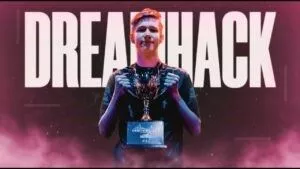 Mr Savage holds up the DreamHack Winter trophy after winning the Winter LAN