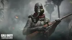 A Call of Duty operator stands in the midst of a smoke filled battlefield wearing a mask and holding his rifle