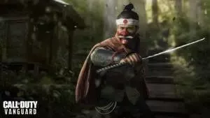 A Call of Duty operator in Samurai head dress and armor weilds a Katana on a lush forest path