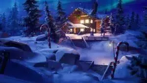 A winterfest cabin nestled amongst the snowdrifts with christmas trees and candy canes surrounding it