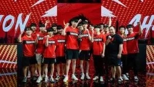 The Shanghai Dragons stand together in their team jerseys ahead of 2021's Overwatch League's Championship competition